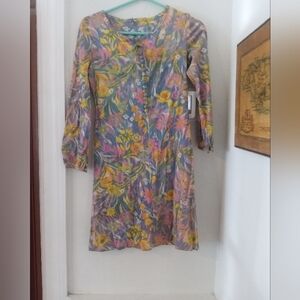 A dress from the 1980s of flower child dress the zips up the back